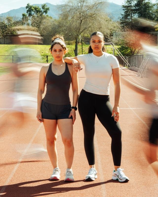A pair sprinting side by side on the track